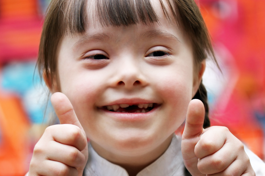 Happy girl showing thumbs up