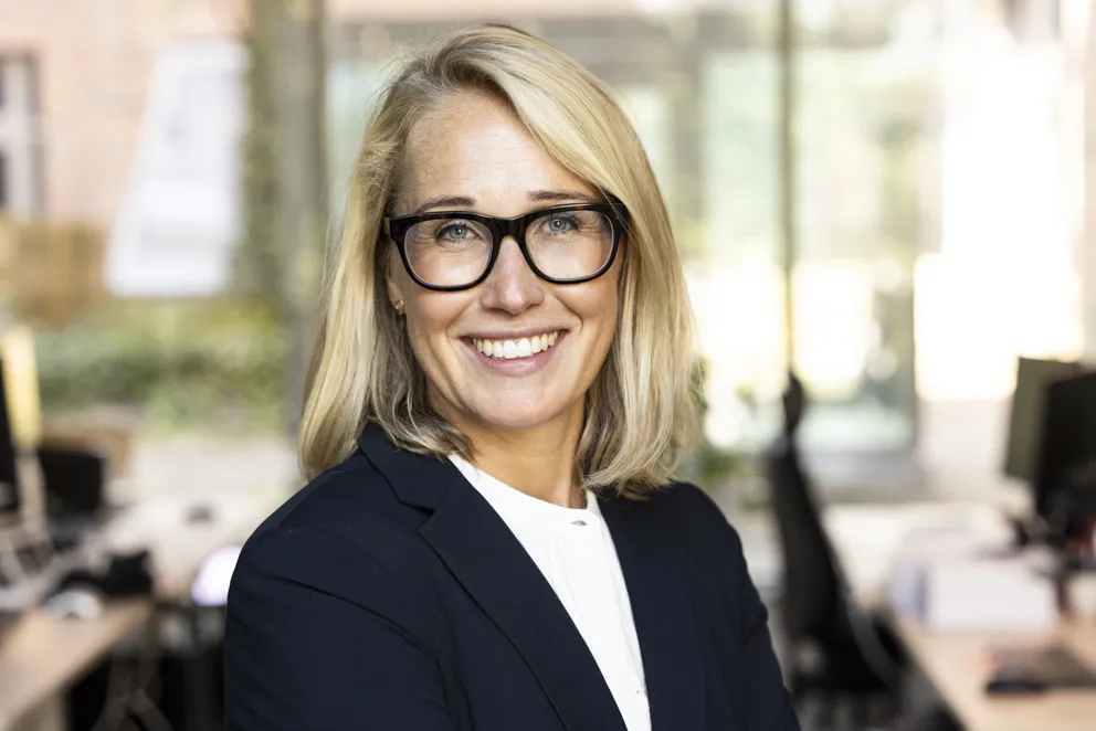 Portrait of business woman with blonde hair and glasses